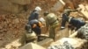 Rescuers search for survivors after a wall collapsed during the reconstruction of a building in Novosibirsk.