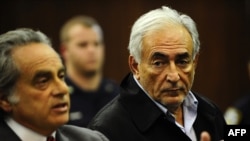 Dominique Strauss-Kahn (right), director-general of the International Monetary Fund, is seen with his laywer, Benjamin Brafman, at his arraignment in New York on May 16.