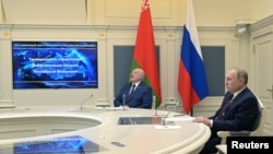 Russian President Vladimir Putin (right) and Belarusian strongman Alyaksandr Lukashenka observe ballistic missile exercises from the Kremlin situation room in Moscow on February 19. 