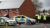 Police officers guard the cordoned-off area around the home of former Russian intelligence officer Sergei Skripal in Salisbury, Britain, on April 3.