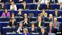 European Commission President Jose Manuel Barroso (right) gives a speech as he is surrounded by the newly elected team of EU commissioners at the EU Parliament in Strasbourg.