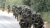 Israeli soldiers on patrol near the border with Lebanon on July 13