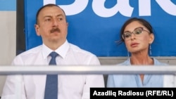 Ilham Aliyev (left) and Mehriban Aliyeva attend a sports conference in Baku last year.