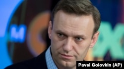 Aleksei Navalny is calling on Russians to boycott next month's presidential vote.