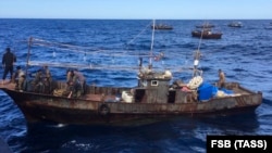 Russian border guards detain North Korean poachers in Russian waters in the Sea of Japan on September 18.