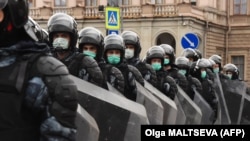 "Just plain, old-fashioned authoritarianism”? Russian riot police block a street during a rally in support of jailed Kremlin critic Aleksei Navalny in central St. Petersburg on April 21.