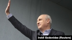 Former Georgian Prime Minister Vano Merabishvili waves to supporters after being released from prison on February 20.