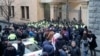 Georgian opposition supporters rally in front of the parliament building in Tbilisi on November 28.