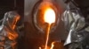 Workers wearing heatproof overalls pour molten gold from a crucible into molds in a workshop at the Kumtor gold mine in the Tien Shan mountains, some 350 kilometers southeast of the capital, Bishkek. 