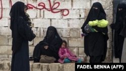 Displaced Syrian women and children are pictured at a camp in northeastern Syria on February 7.